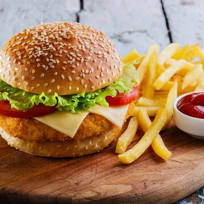 Chicken burger with fries and ketchup at The Hill Bar & Grill in Glyndon MN restaurant food and bar.