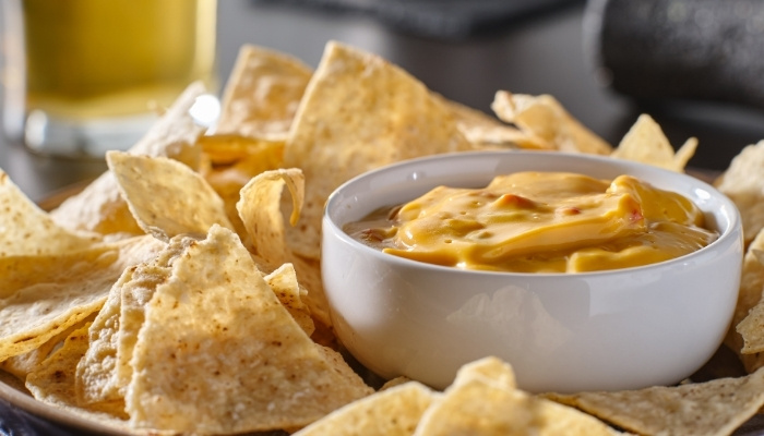 A bowl of cheese dip with tortilla chips at The Hill Bar & Grill in Glyndon MN.