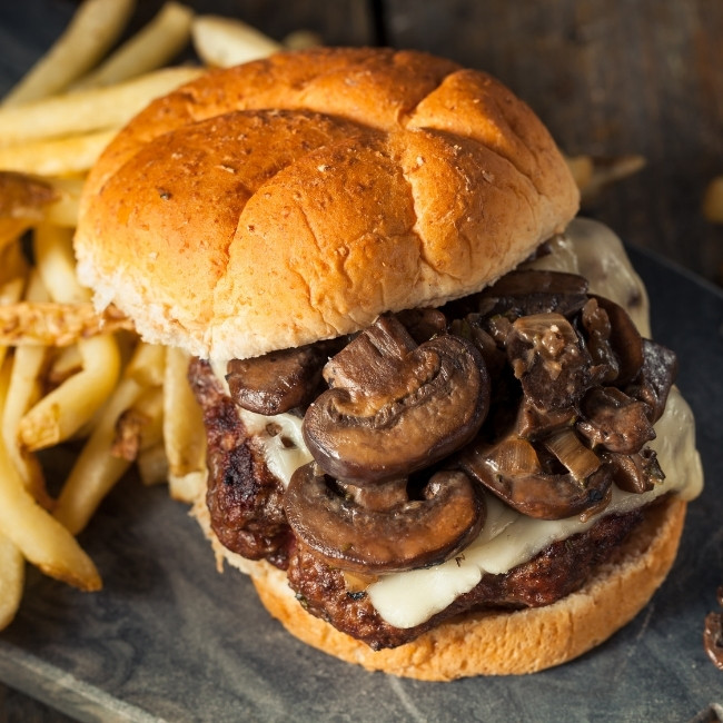 Mushroom and Swiss cheese burger with fries at The Hill Bar & Grill in Glyndon MN.