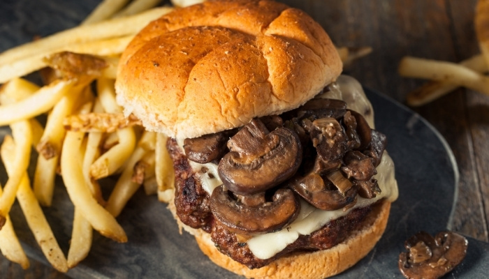A mushroom Swiss burger with fries at The Hill Bar & Grill in Glyndon MN.