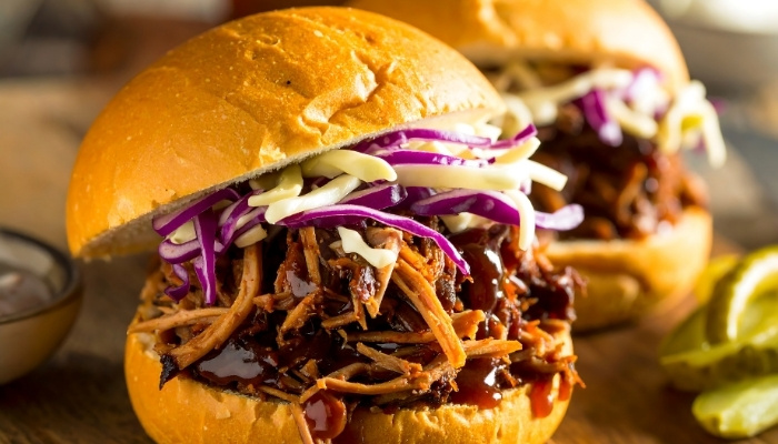 Pulled pork sandwiches with barbecue sauce, slaw, and pickles at The Hill Bar & Grill.